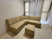 Sillón esquinero beige impermeable